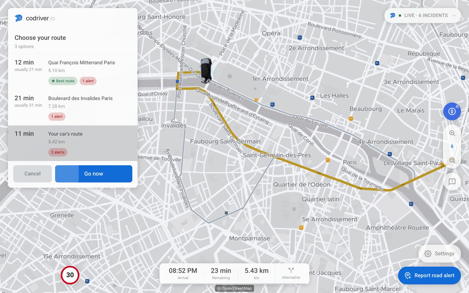 codriver's route picker on the simulated Paris drive: Choose your route lists three options, Your car's route is selected, its line is drawn in gold on the map, and the Go now button is below